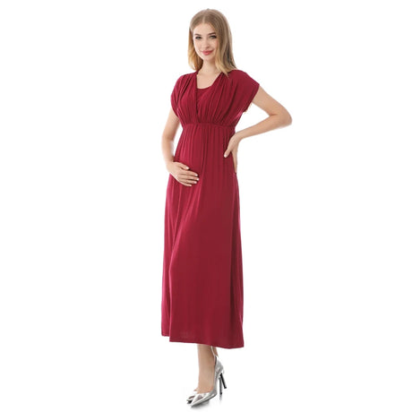 Soft fabric nursing maternity dress in burgundy, designed for postpartum comfort and breastfeeding.