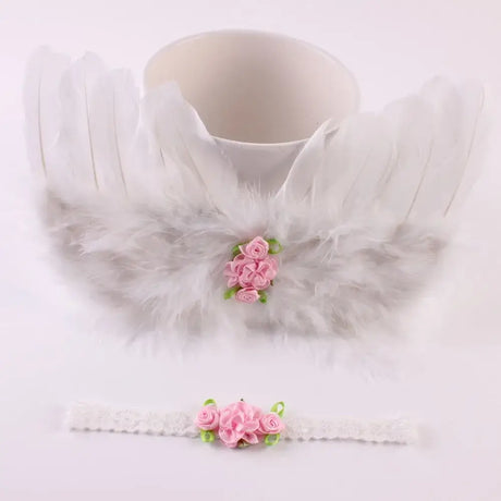 Cute newborn angel feather wings with pink rose headband for baby girls, perfect photo prop for ages 0-24 months.