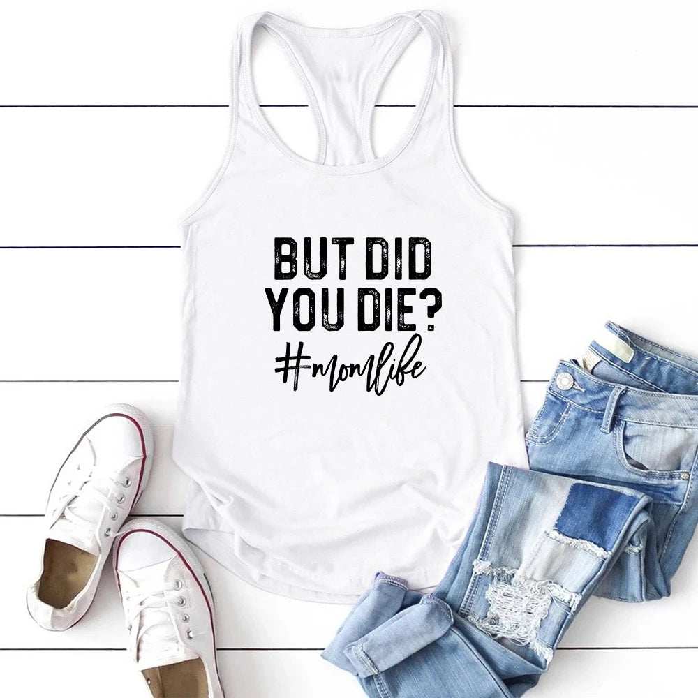 White casual tank top with "But Did You Die? #momlife" print, paired with denim shorts and sneakers.