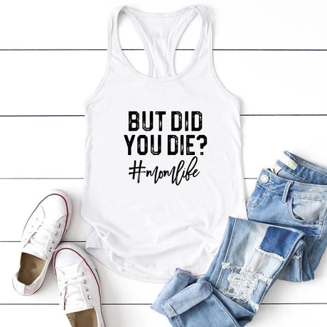 White casual tank top with "But Did You Die? #momlife" print, paired with denim shorts and sneakers.