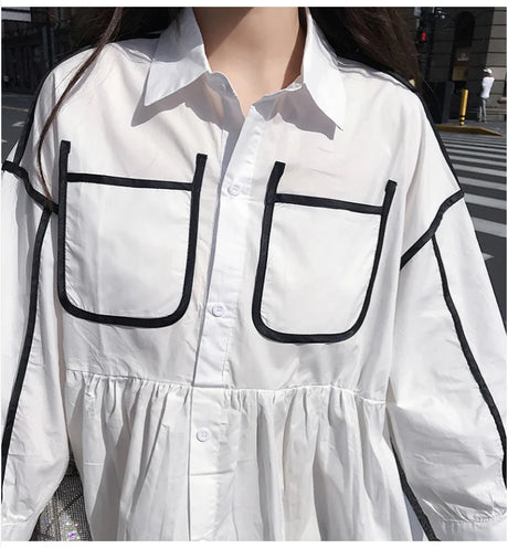 Solid color maternity shirt dress with turn-down collar and contrast pockets, perfect for summer beach parties.