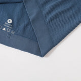 Close-up of MonoSculpt™ one-shoulder seamless crop top revealing fabric composition and care instructions.