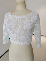 Crystal Lace Wedding Bolero with 3/4 sleeves, featuring intricate appliqué detailing and a stylish, sheer design.