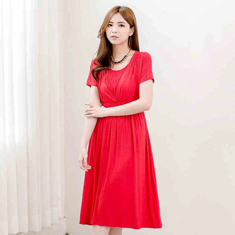 Soft fabric maternity dress in vibrant red, perfect for postpartum and breastfeeding, featuring a flattering V-neck and mid-calf length.