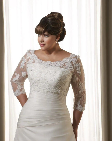 Elegant woman in a crystal lace wedding bolero with 3/4 sleeves, complementing a bridal gown.