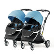 Blue twin baby stroller with adjustable canopies, designed for infants and toddlers, featuring a foldable aluminum frame.