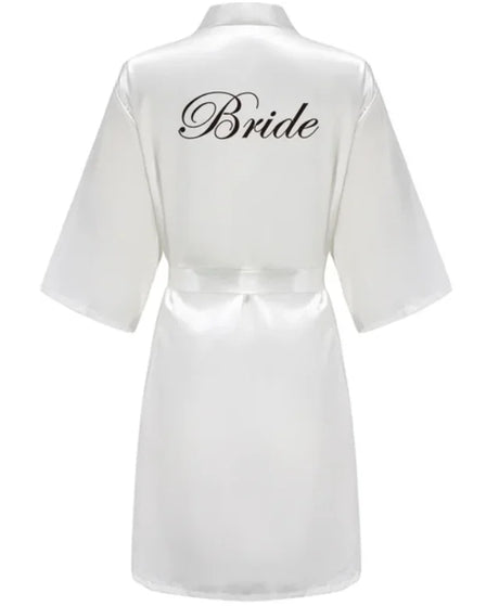 Team Bride satin robe in white with stylish 'Bride' lettering on the back, ideal for wedding celebrations.