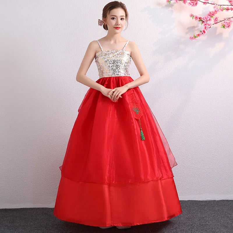 Traditional red Korean hanbok dress with floral design and a flowing skirt, ideal for cultural dances and celebrations.