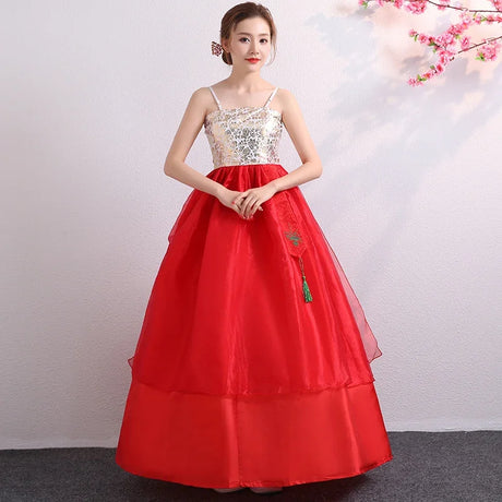 Traditional red Korean hanbok dress with floral design and a flowing skirt, ideal for cultural dances and celebrations.