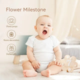 Baby holding a wooden flower milestone sign for 7 months, ideal for photo props and room decoration.