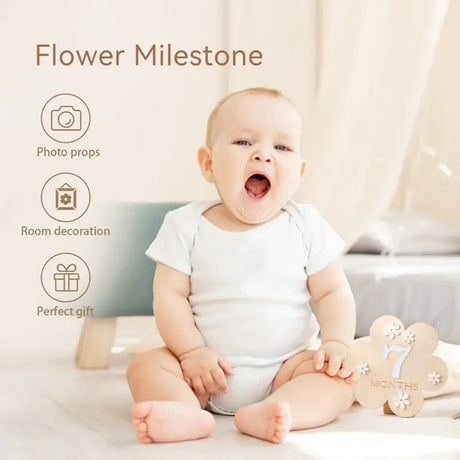 Baby holding a wooden flower milestone sign for 7 months, ideal for photo props and room decoration.