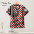 Pediatric nursing scrub top featuring a playful heart print design, made from 100% cotton, women's V-neck style.