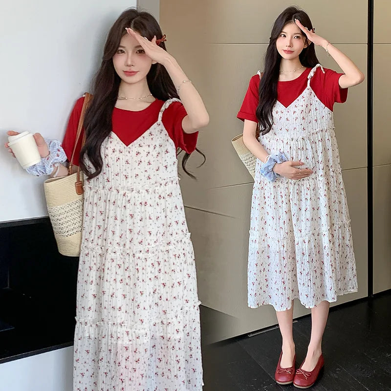 Stylish model in a floral two-piece maternity skirt with contrasting color, perfect for summer wear.