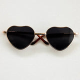 Heart-shaped baby glasses for newborn photography, stylish black lenses with a colorful frame, unisex design.
