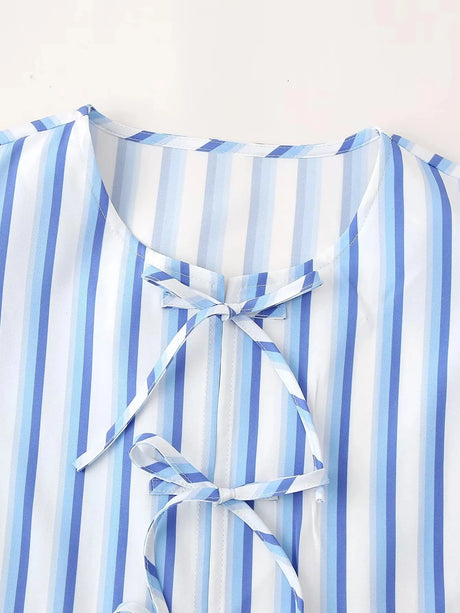Detail of BowChic™ Stripe Lace-Up Blouse, featuring blue and white stripes and a lace closure.