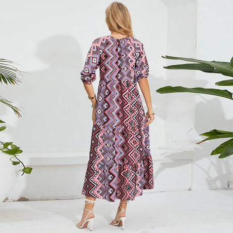 Elegant beach maternity dress with geometric patterns, ideal for summer photoshoots, showing the back view.