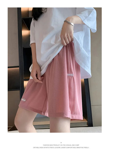 Plus size wide leg maternity pants in light pink, perfect for summer, casual comfort for expectant mothers.