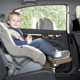 Child enjoying a safe ride in an adjustable and foldable car safety seat, showcasing comfort and security for kids.