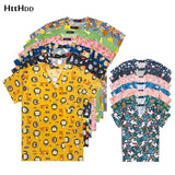 Colorful women’s hospital nurse scrubs featuring animals and floral prints, ideal for medical and beauty professionals.