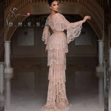 Elegant Arabic nude stone wedding gown with tiered sleeves in beige, featuring beaded embellishments and a sweetheart neckline.