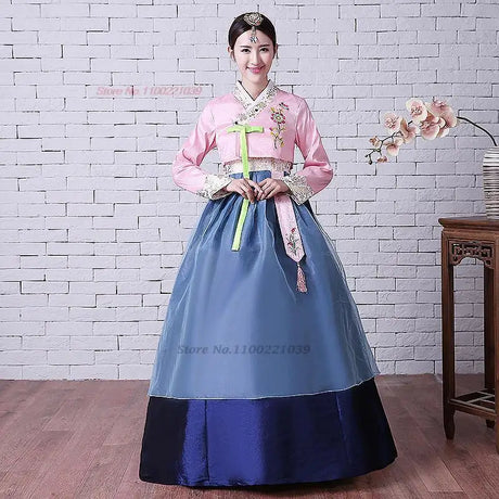 2025 Korean Hanbok dress featuring a pink top and blue skirt, perfect for traditional events and cultural celebrations.