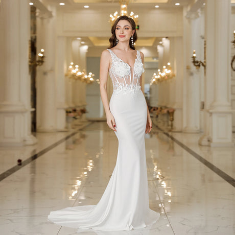 Elegant MisShow white mermaid wedding dress with lace and pearl decorations, showcasing a stunning backless design.