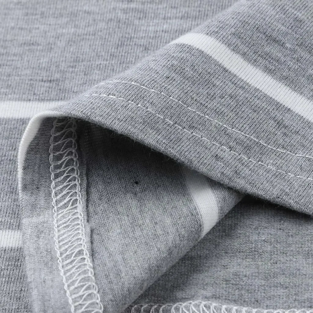 Close-up of gray striped fabric showing soft texture and stitching details for a nursing dress.