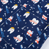 Patterned fabric featuring playful teeth and toothbrushes on a navy background for nurse scrubs.