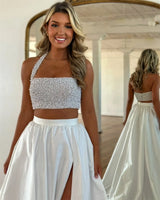 Model wearing a detachable taffeta wedding overskirt with a sparkly crop top in a bright indoor setting.