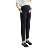 Formal black maternity pants for women, featuring a comfortable fit and pockets, ideal for summer work wear.