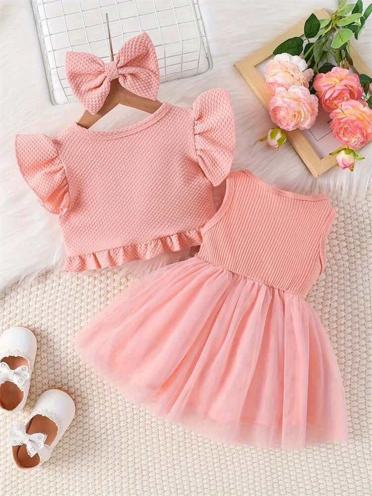Newborn girls dress set with short sleeves, ruffled top, and tulle skirt in pink, perfect for summer occasions.