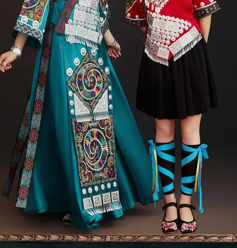 Miao embroidery suit for women featuring vibrant designs, a long skirt, and a festive festival costume look.