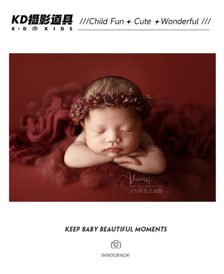 Newborn girl wearing a faux flower headband during photography session, showcasing adorable and peaceful expression.
