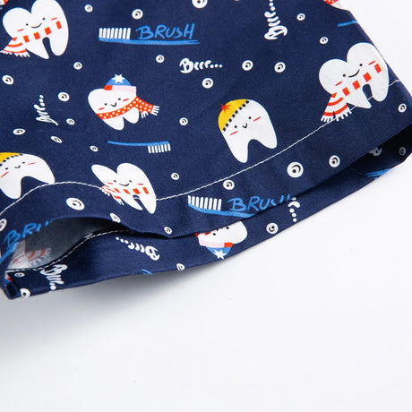 Navy blue cotton nurse scrubs with fun tooth and brush print, ideal for medical or dental professionals, ensuring comfort and style.