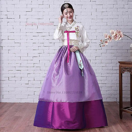 2025 Korean Hanbok dress featuring floral design, full sleeves, and vibrant purple skirt, ideal for traditional occasions.