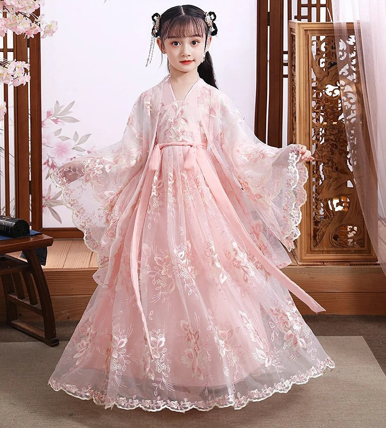 Girl in a pink Chinese Hanfu dress with floral embroidery, perfect for cosplay or special occasions.