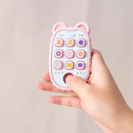 Cute pink bear-shaped toy phone with colorful buttons for kids, featuring music, camera, and messaging icons.