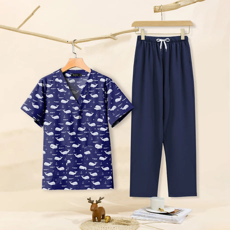 Cartoon print dental scrubs for women, featuring a whale design top and navy pants, perfect for pet grooming workwear.