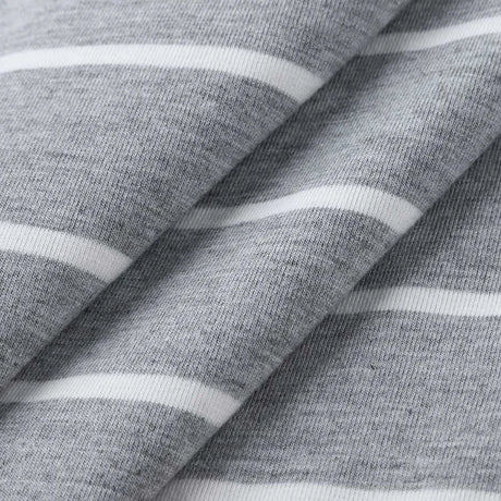 Close-up of grey striped fabric featuring soft textures and white lines, ideal for a multifunctional dress.