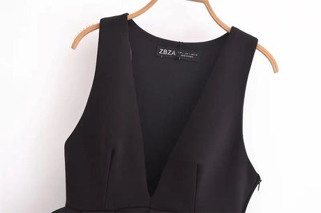 Elegant black V-neck tank top on a hanger, perfect for casual and party wear for women.