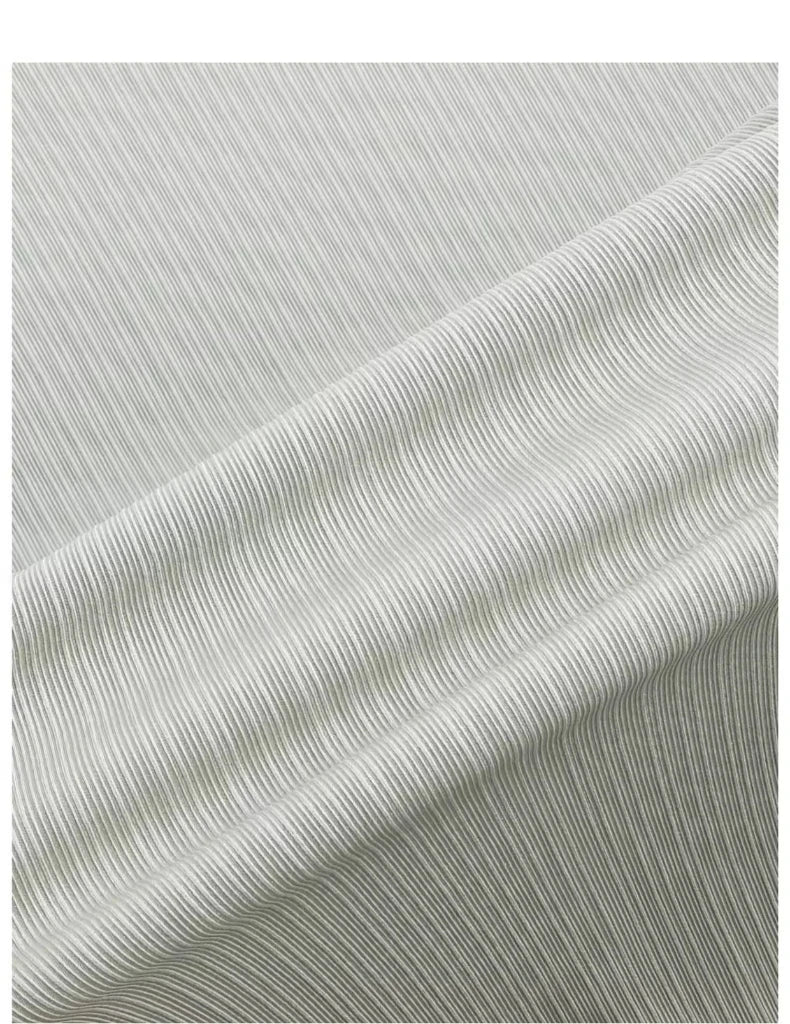 Close-up of textured striped fabric in light color, ideal for crafting or clothing projects.