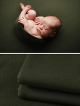 Newborn soft wrap blanket in dark green, perfect for photography, cuddling, and keeping babies cozy.