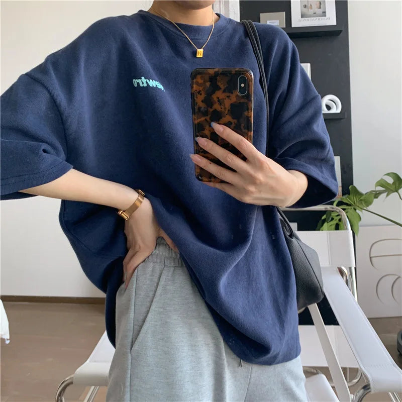 Casual oversized Harajuku streetwear tee in navy, paired with grey sweatpants, perfect for junior women's fashion.