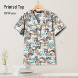 Colorful printed top made of 100% cotton, featuring a playful animal design, perfect for pediatric nursing uniforms.