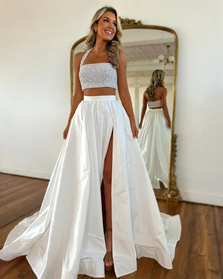 Bridal model wearing a detachable taffeta maxi skirt with a strapless cropped top in a stylish setting.