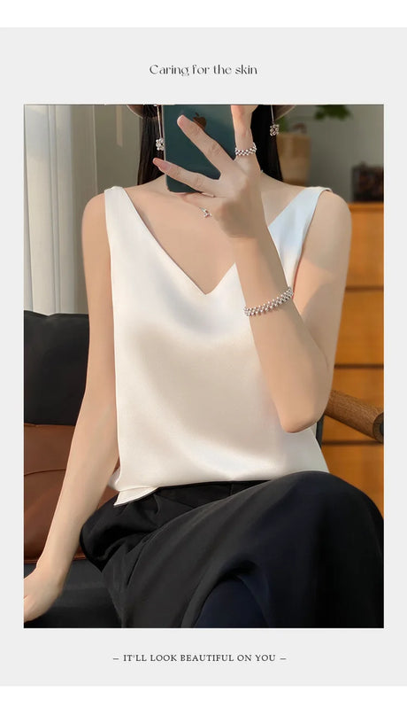 Model wearing a SilkVibe™ white satin V-neck camisole, showcasing summer style and elegance.