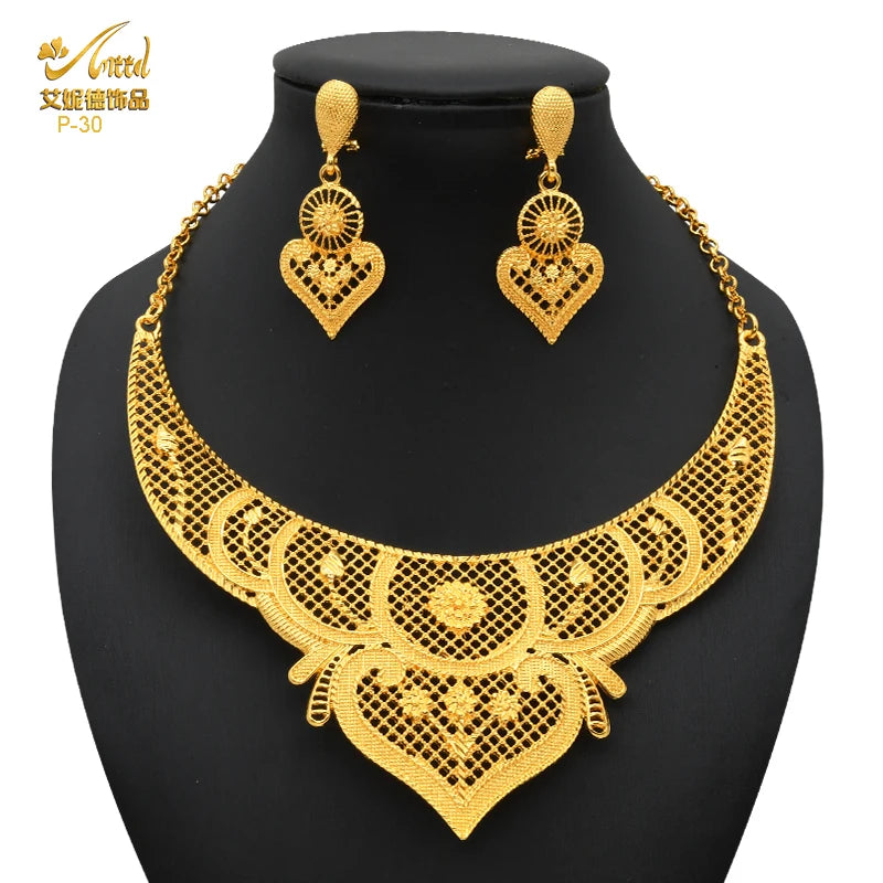 Luxury Indian bridal jewelry necklace set with matching earrings in 24K gold plated design, perfect for weddings.