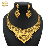 Luxury Indian bridal jewelry necklace set with matching earrings in 24K gold plated design, perfect for weddings.