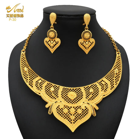 Luxury Indian bridal jewelry necklace set with matching earrings in 24K gold plated design, perfect for weddings.