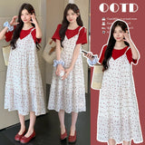 Maternity floral two-piece skirt outfit in contrasting colors, perfect for summer casual wear.